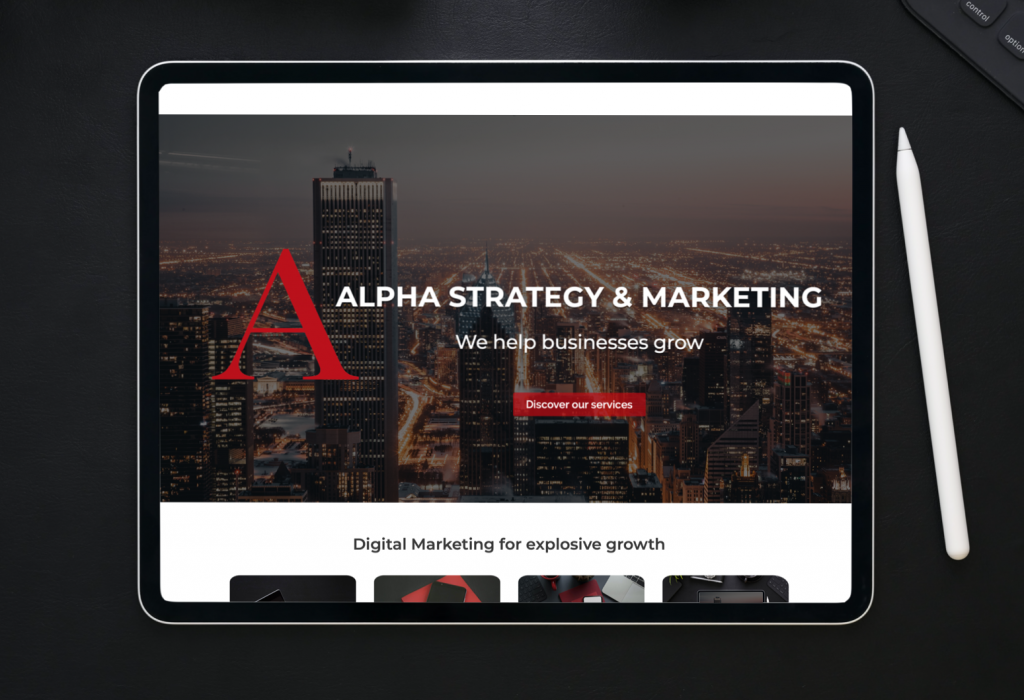 A tablet displaying the home page of Alpha Strategy & Marketing which symbolizes web development